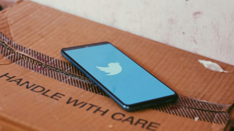 black ipad on brown wooden table
